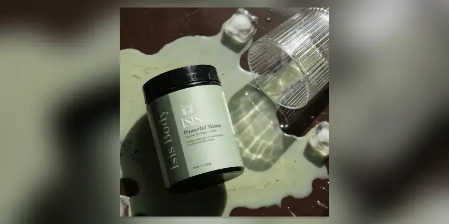 Isis Superfood Powerful Mama matcha supplement jar beside a prepared drink